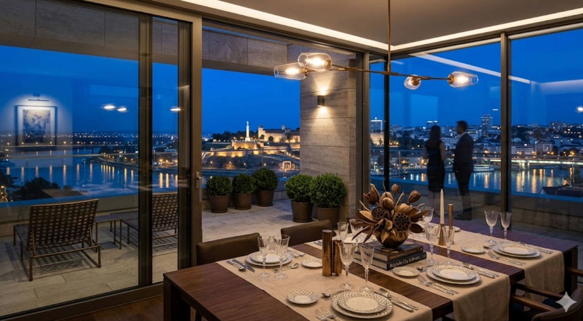 Penthouse dining room with panoramic night view of Belgrade fortress